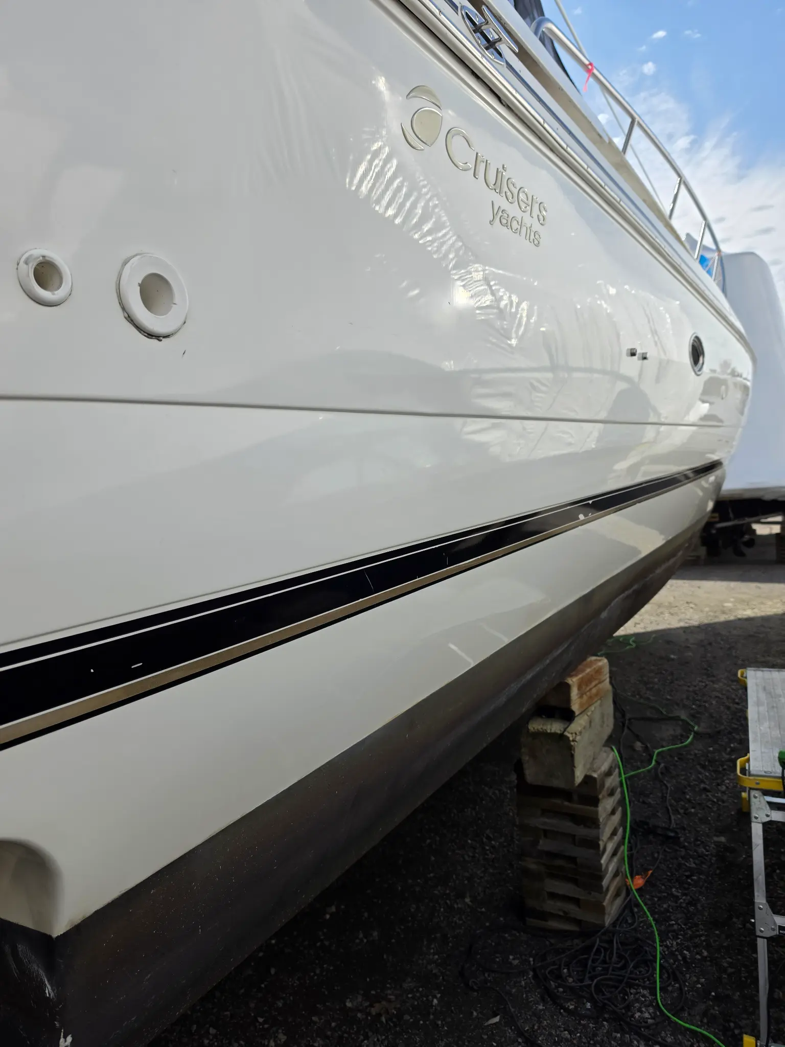 Cruisers Yachts hull after gelcoat restoration with brighter finish and restored reflection